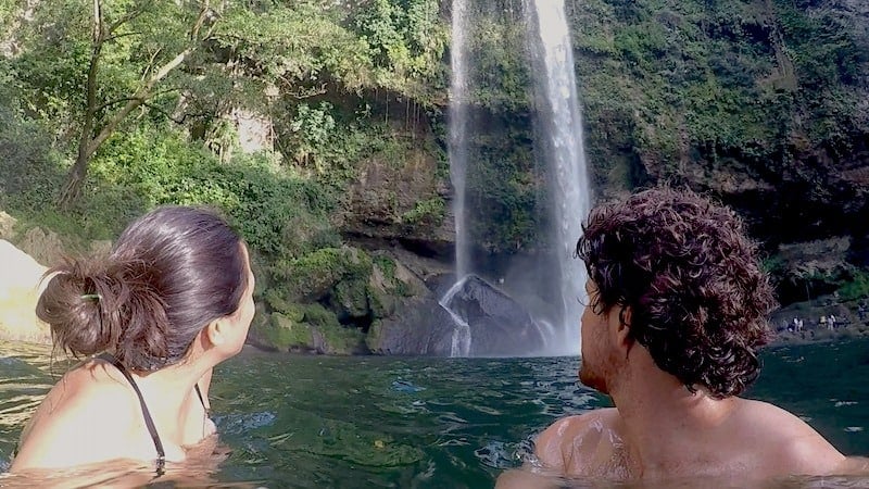 Kristina and Michael from Off Path Travels looking at the Cascada Misol-Ha from below.