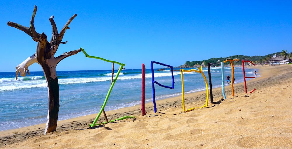 Playa Zipolite sign on one of the best beaches in Oaxaca, Mexico