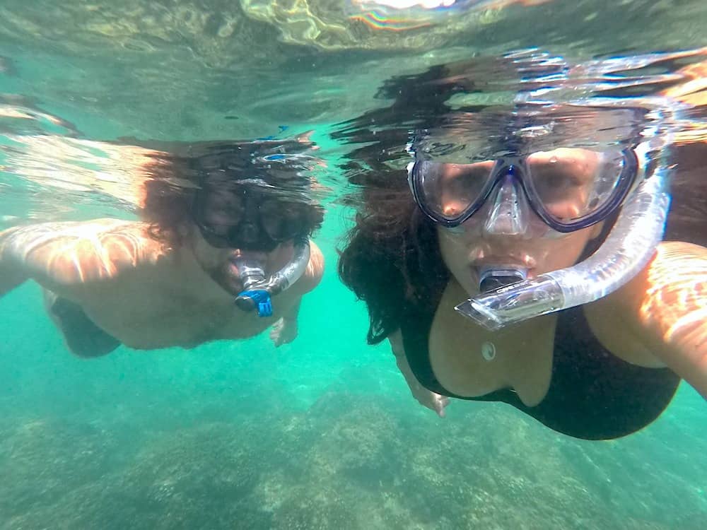 Kristina and Michael from Off Path Travels snorkeling in one of Huatulco's attractions