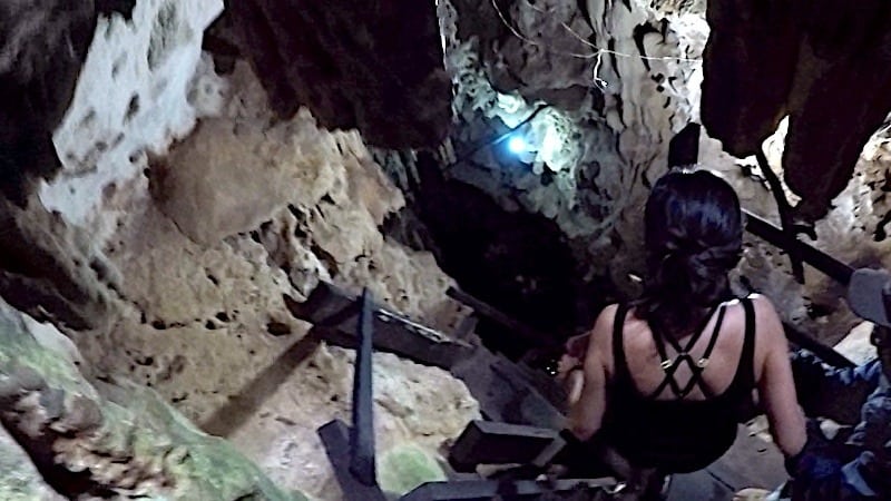 Kristina climbing down the stairs at cenotes Cuzama to Tzapakul