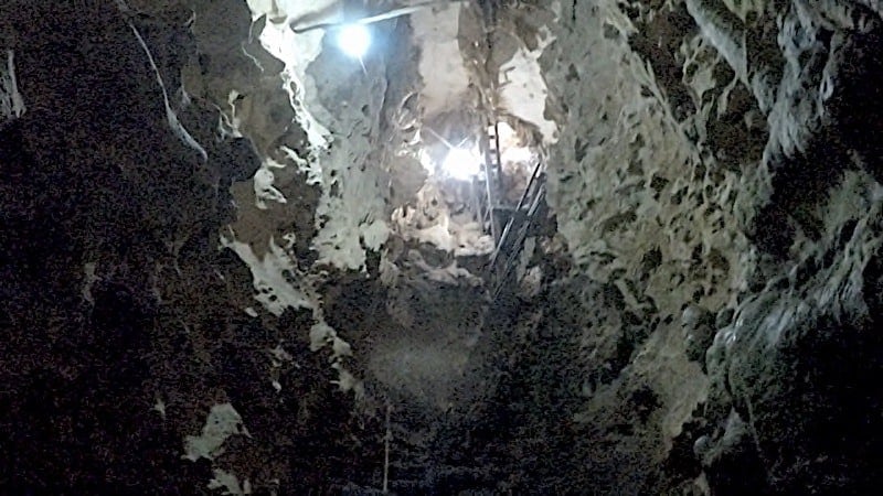 Looking at the steep staircase at the narrow Tzapakul cenote Cuzama