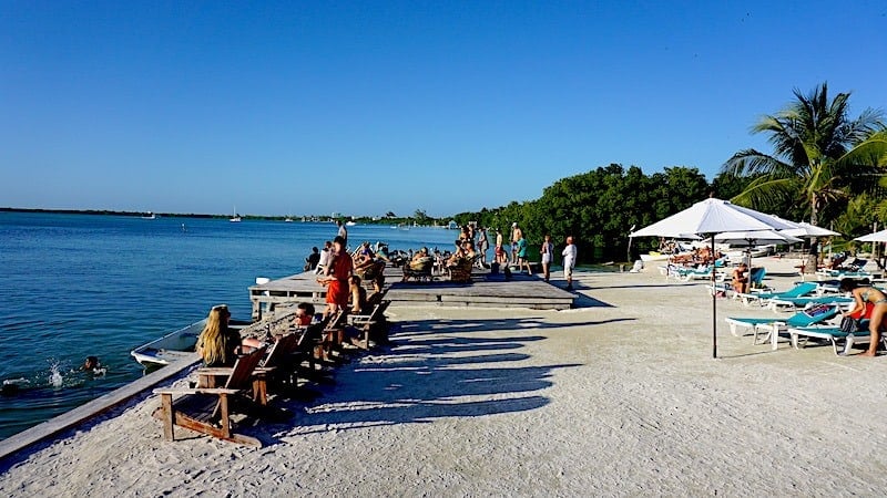 The Iguana Inn's seating area near the water