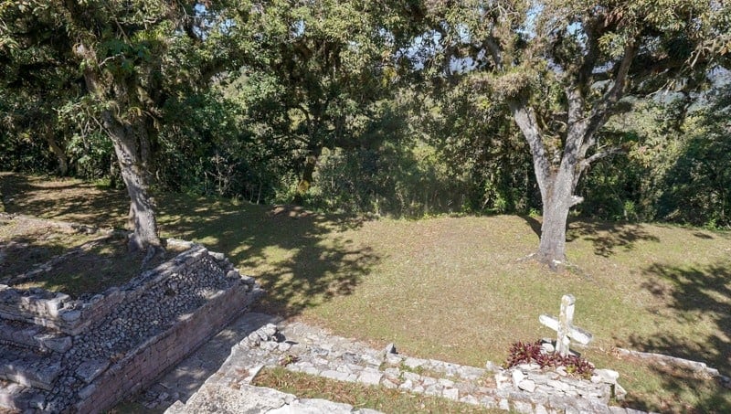 The wooden cross that marks the current spriritual location at Tenam Bridge ruins in Chiapas, Mexico