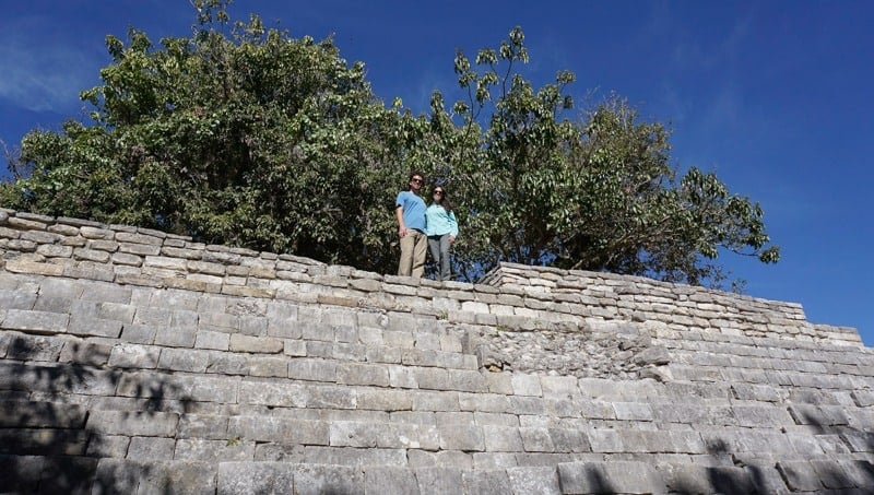Kristina and Michael from Off Path Travels on top of one of the smaller temples in Plaza A at Tenam Bridge ruins