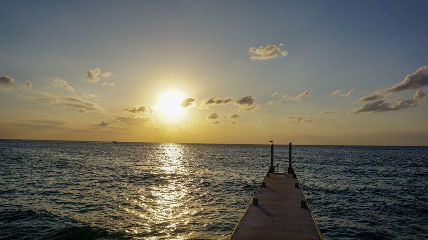 The sunset view at The Money Bar, a great place for happy hour in Cozumel