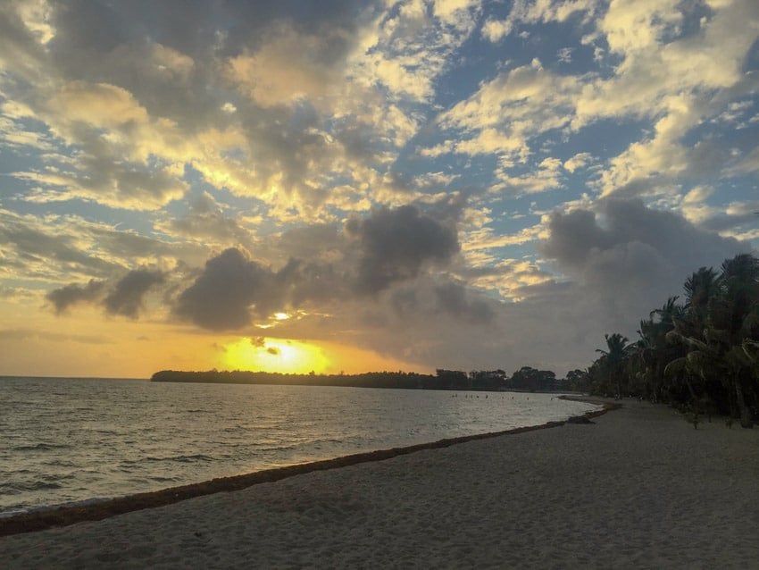 A sunset on the beach near the municipal pier in Placencia