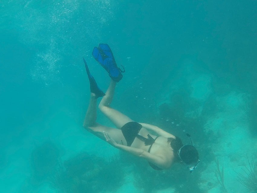 Kristina doing one of her favorite things to do in Placencia: snorkeling