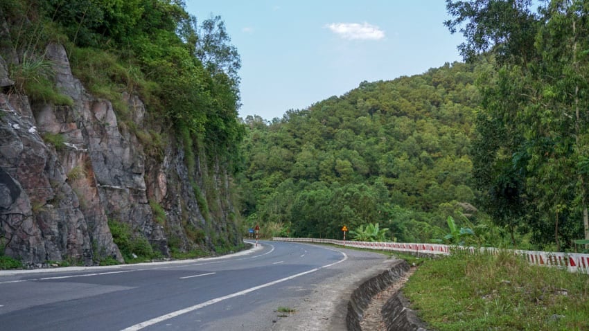 The windy mountain road leading away from the Cat Ba Island city center and to the Cat Ba National Park and the many caves to visit