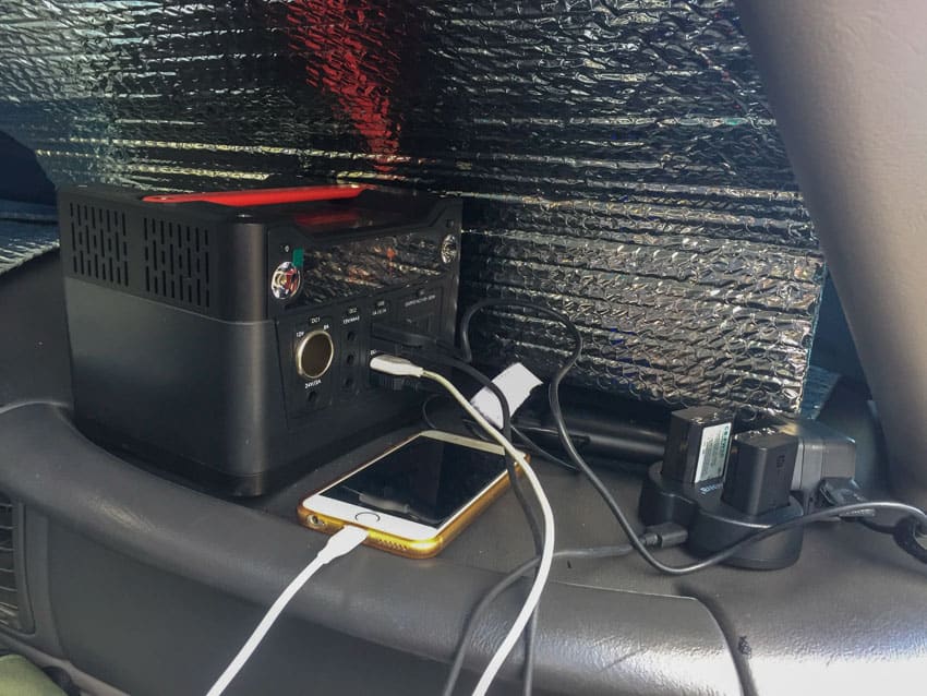 Keeping our things charged while the solar panel sits inside of the car's windshield
