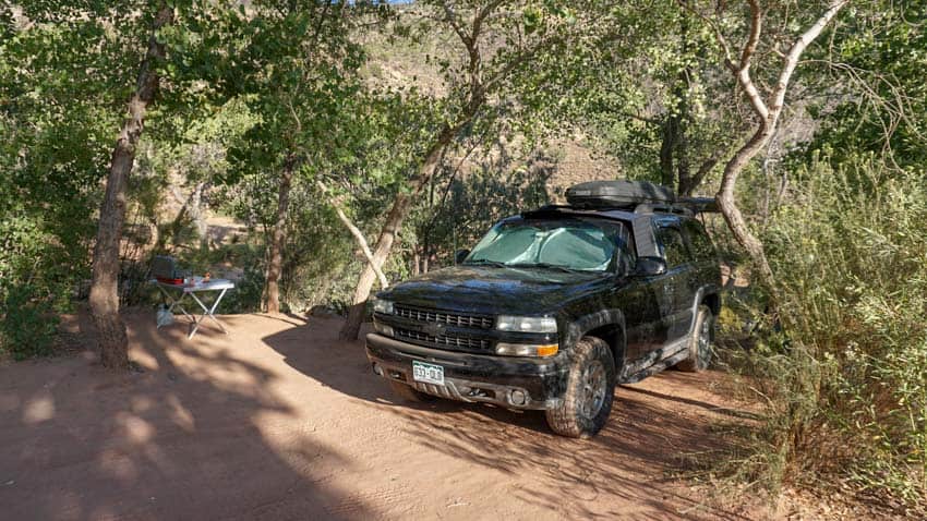The Rockpals solar panel on top of Off Path Travels' Tahoe in the Utah wilderness