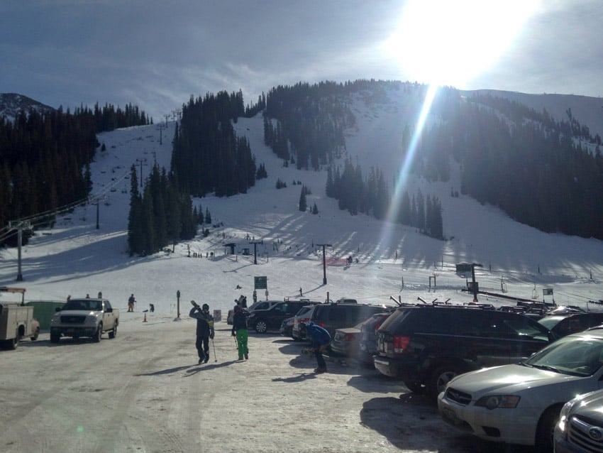 Sunrise coming up over the mountain at a small ski resort in Colorado