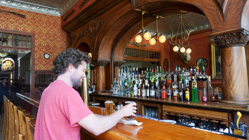 Michael getting a beer at the Grand Imperial Hotel along his Colorado road trip