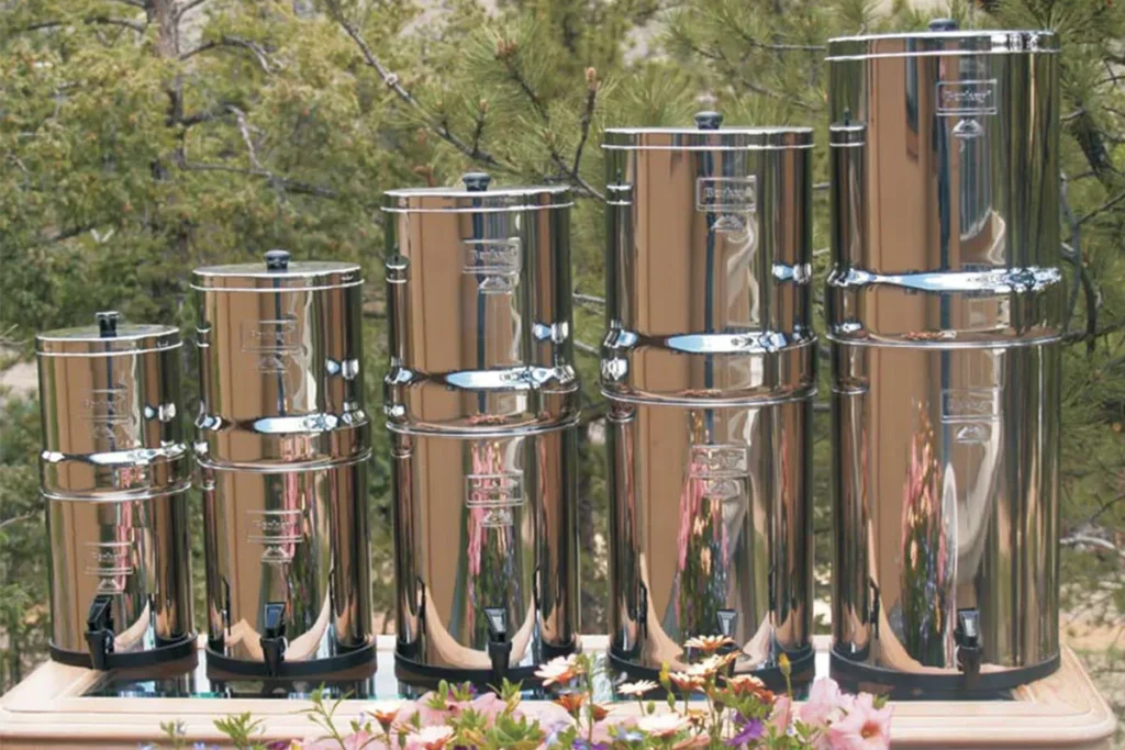 The lineup of Berkey water filters outside on a table